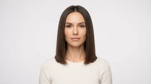 Woman with soft blunt collarbone-length haircut facing front under even studio lighting against white backdrop